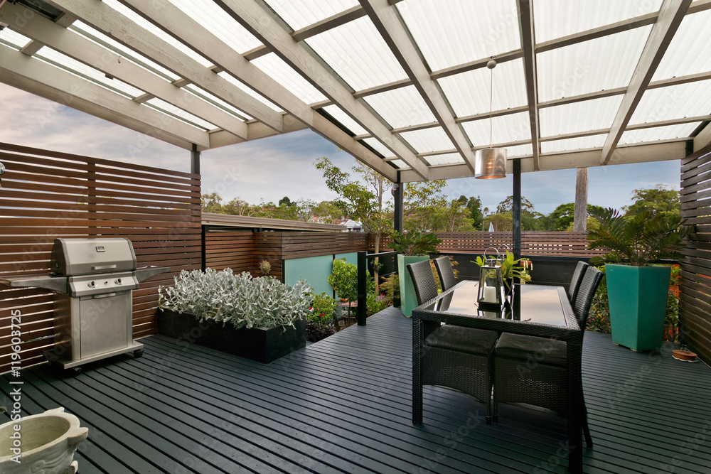 back yard with outdoor seating and barbecue with family back yard with outdoor seating and barbecue with family