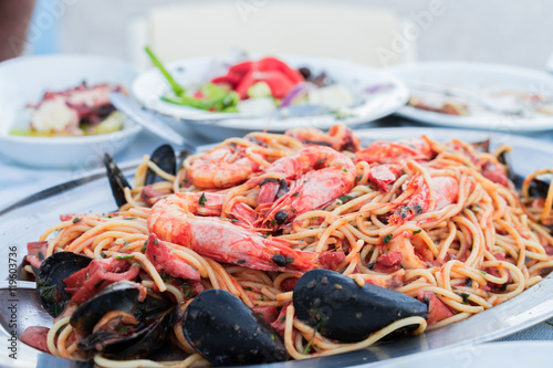 Seafood Spaghetti pasta ,makaronada with seafood, shrimp, mussels, lobster. fishv restaurant taverna in Greece.