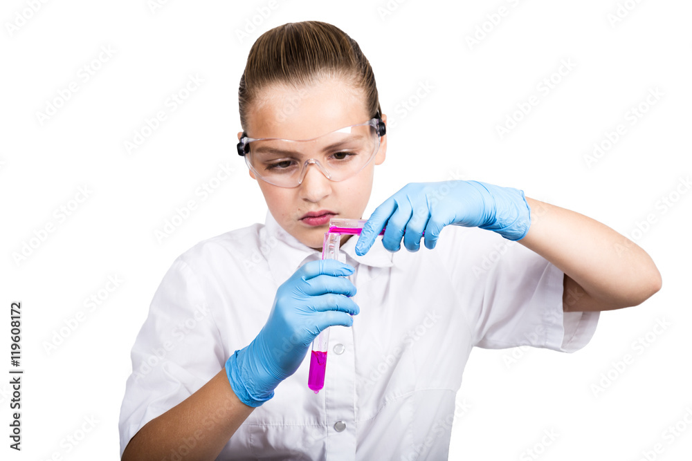 Attentive schoolgirl conducting a chemistry experiment at elementary science class Attentive schoolgirl conducting a chemistry experiment at elementary science class