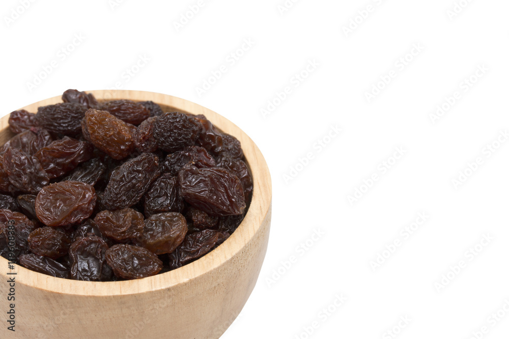 raisins in woodenbowl on white background. raisins in woodenbowl on white background.