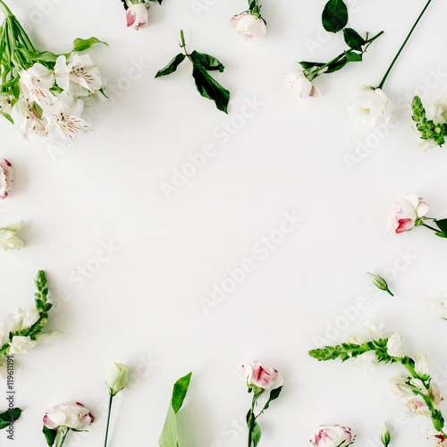 Wallpaper, texture, frame. Pink roses and white flowers on white background. Flat lay, top view