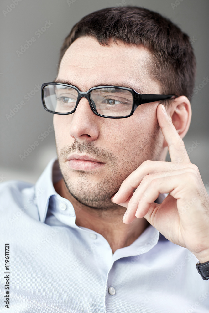 portrait of businessman in eyeglasses at office portrait of businessman in eyeglasses at office