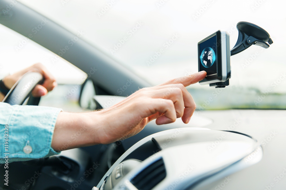 close up of man with gadget on screen driving car close up of man with gadget on screen driving car