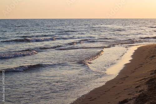 Blue waves of adriatic sea during sunset