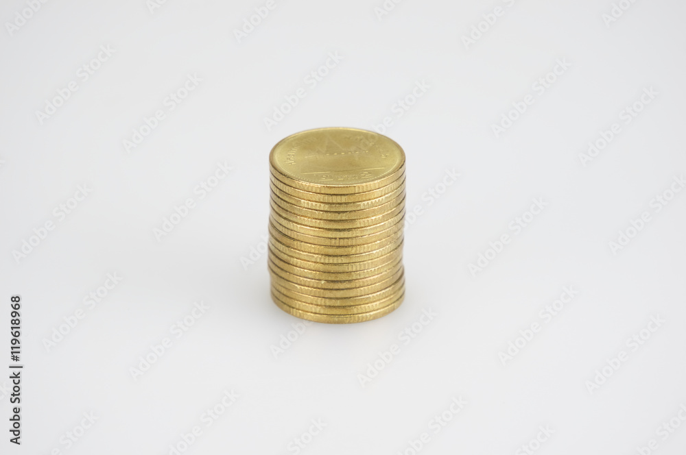Close up pile of gold coins isolated on white background Close up pile of gold coins isolated on white background