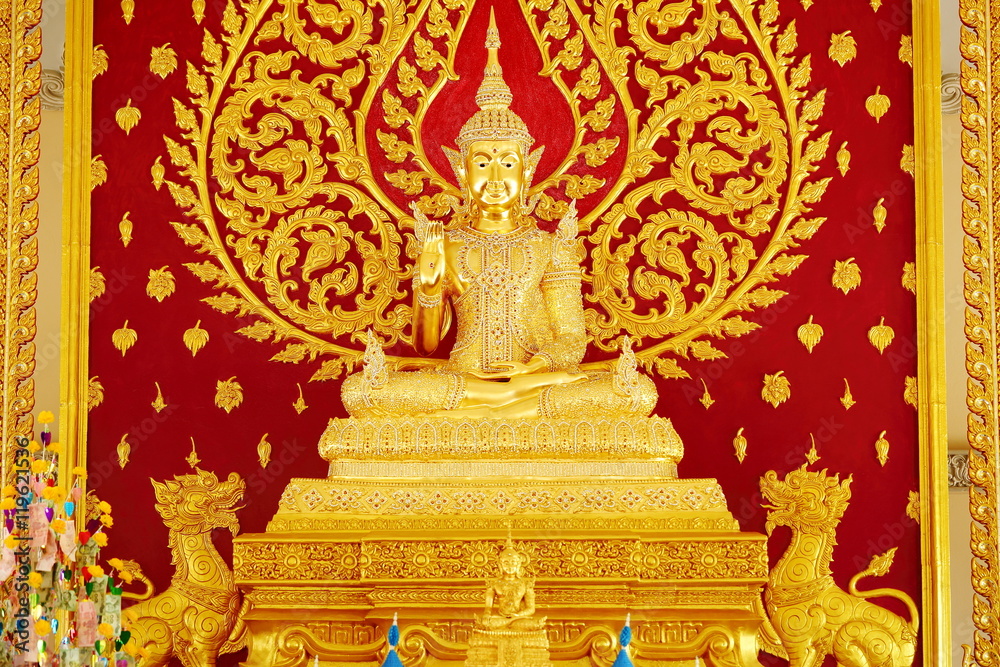 Golden Buddha statue in the temple of Thailand.