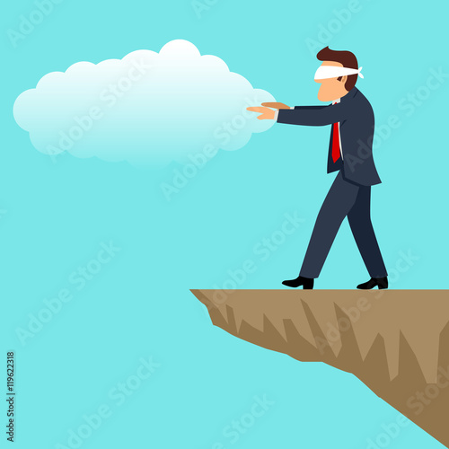 Blindfolded businessman walking into the cliff