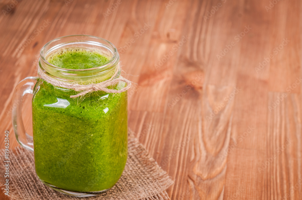 Jar mugs filled with green fresh organic spinach and lime lemon smoothie. Detox concept. Jar mugs filled with green fresh organic spinach and lime lemon smoothie. Detox concept.