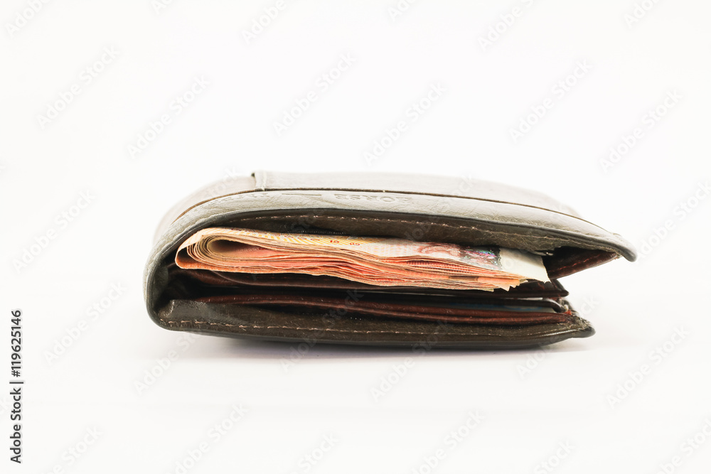 Money in leather purse isolated on white background Money in leather purse isolated on white background