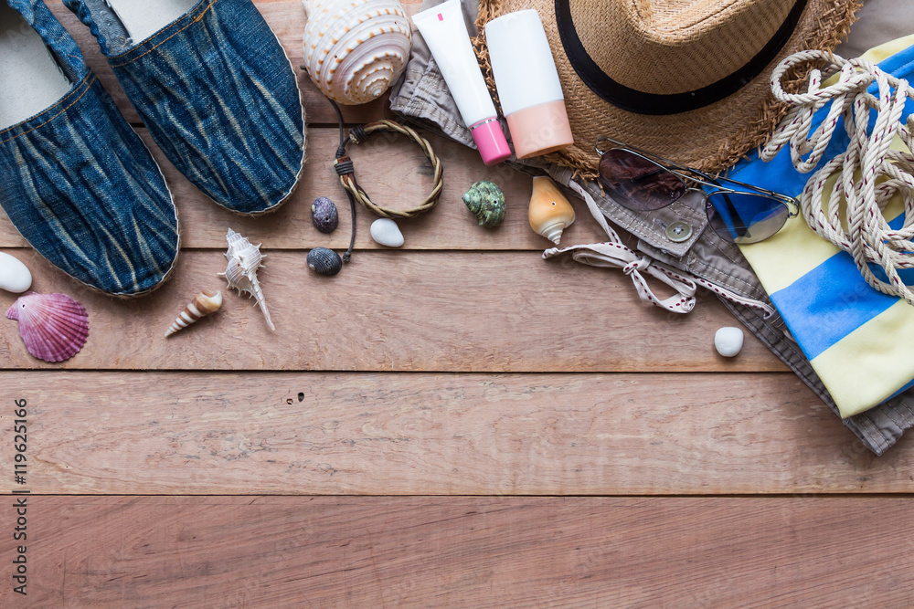 Summer holiday concept, men's accessories and travel items on wooden board, flat lay, top view background Summer holiday concept, men's accessories and travel items on wooden board, flat lay, top view background