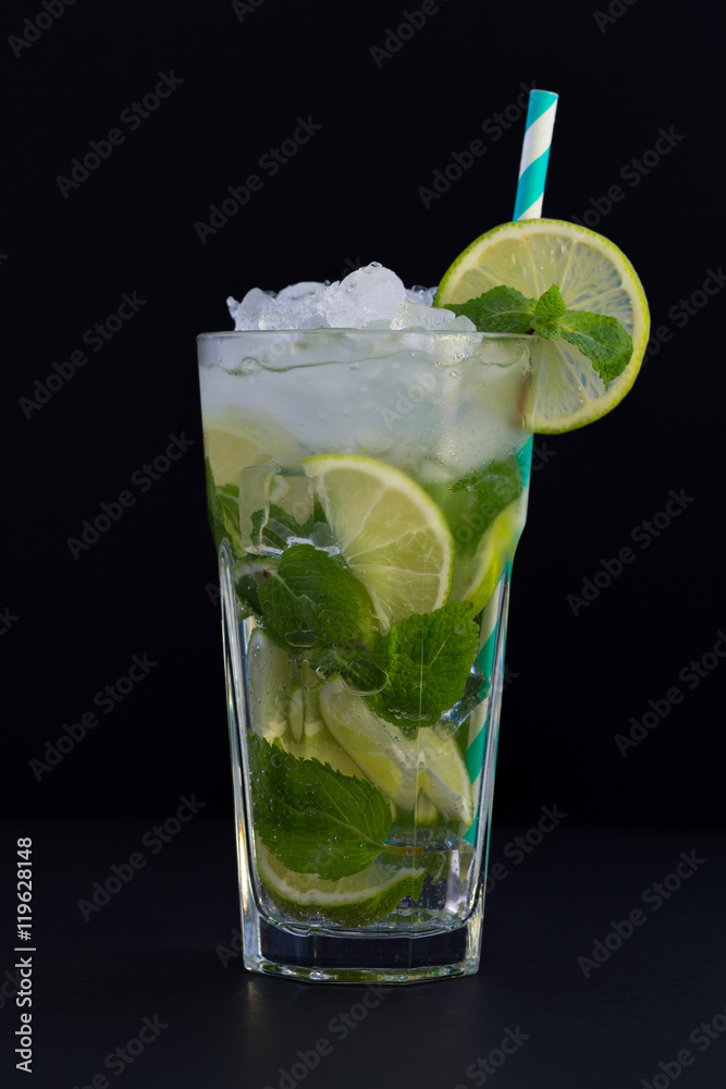 Fresh mojito cocktail on black background. Mojitos with mint leaves, lime and ice Fresh mojito cocktail on black background. Mojitos with mint leaves, lime and ice