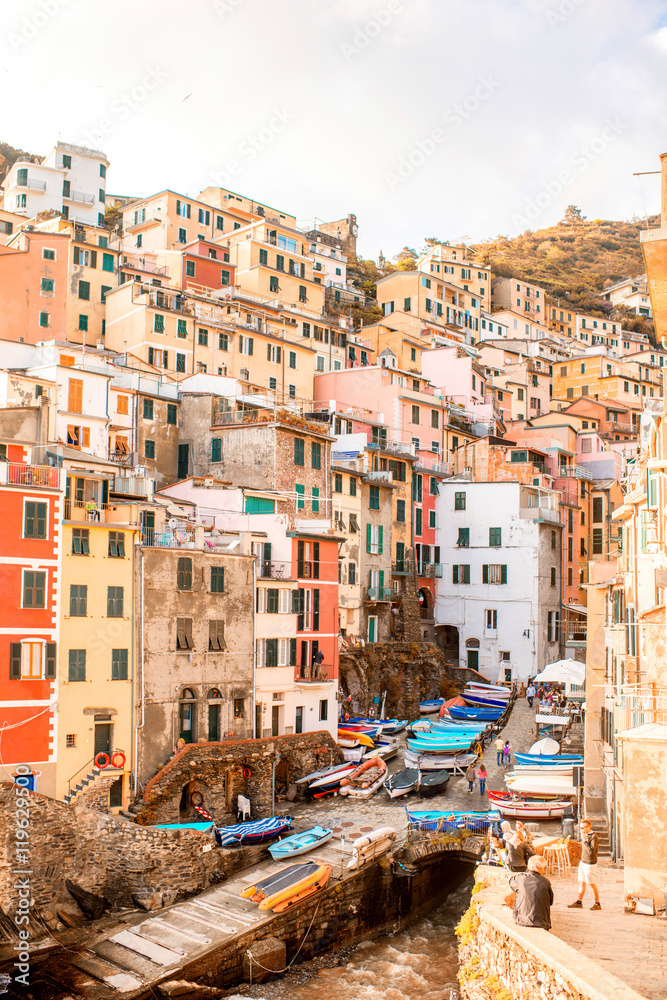 Riomaggiore old town with colorful buildings on the coastal hill in a small valley in the Liguria region of Italy