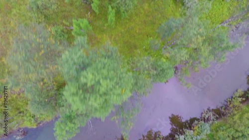 Wallpaper Mural Flying over a creek and trees between high mountains Torontodigital.ca