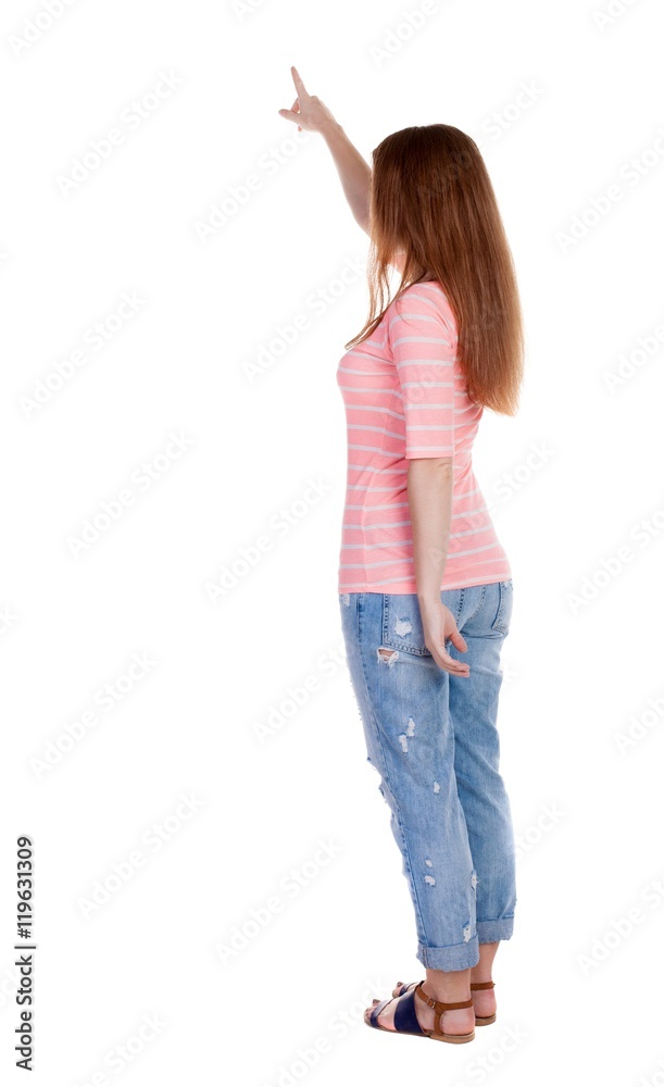Back view of pointing woman. beautiful redhaired girl . girl shows something to someone. Rear view people collection. backside view of person. Isolated over white background. Girl in a white T Back view of pointing woman. beautiful redhaired girl . girl shows something to someone. Rear view people collection. backside view of person. Isolated over white background. Girl in a white T