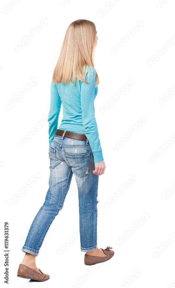 side view of walking woman in jeans. beautiful girl in motion. backside view of person. Rear view people collection. Isolated over white background. side view of walking woman in jeans. beautiful girl in motion. backside view of person. Rear view people collection. Isolated over white background.
