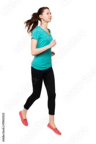 front view of running sport woman. beautiful girl in motion. Sportswoman froze jump. © ghoststone