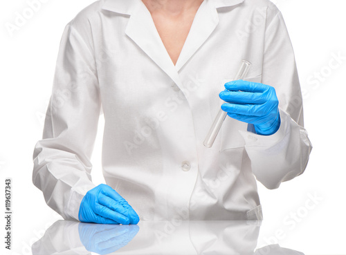 Female in gown and gloves holding empty glass test tube