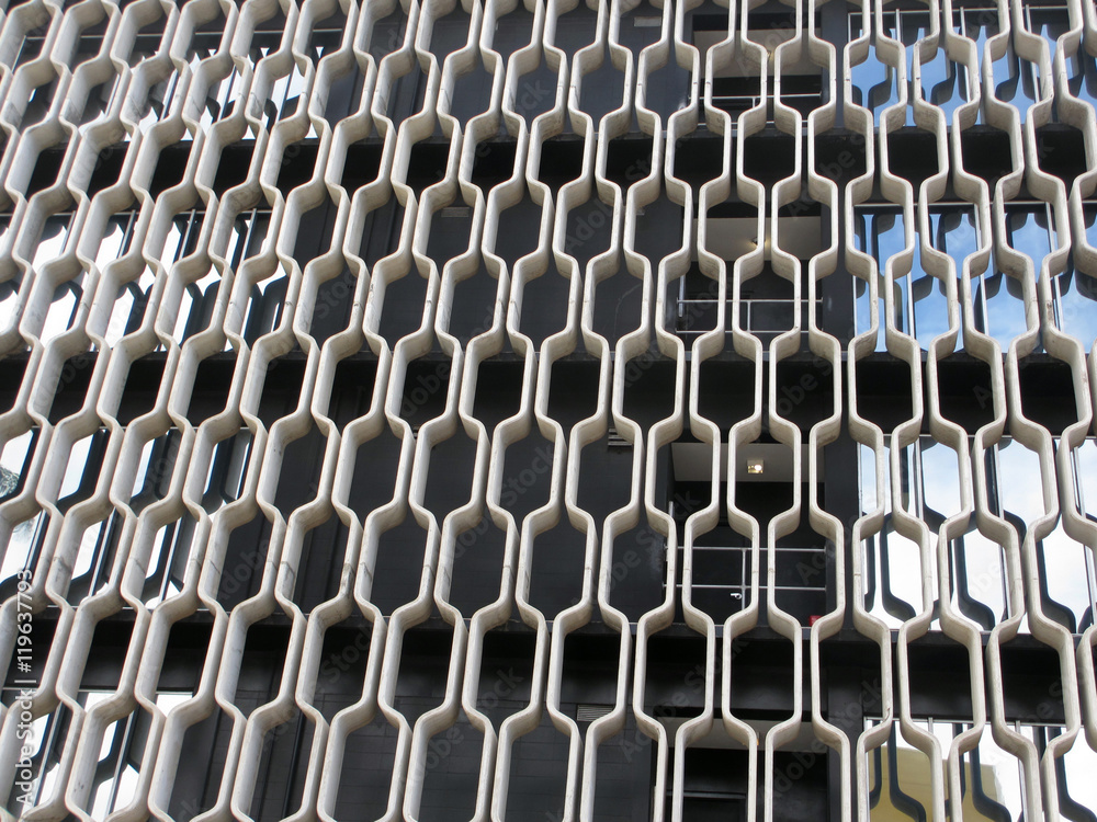 Naklejka premium Curved Concrete Pattern covers side of Building