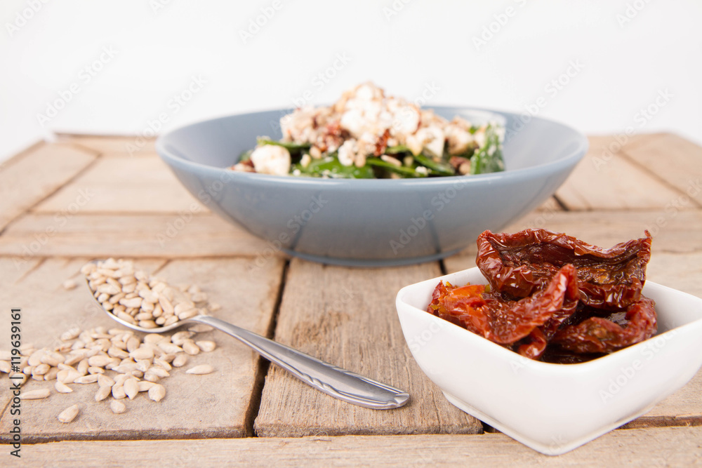Spinach, dried tomatoes, feta cheese and sunflower seeds salad Spinach, dried tomatoes, feta cheese and sunflower seeds salad