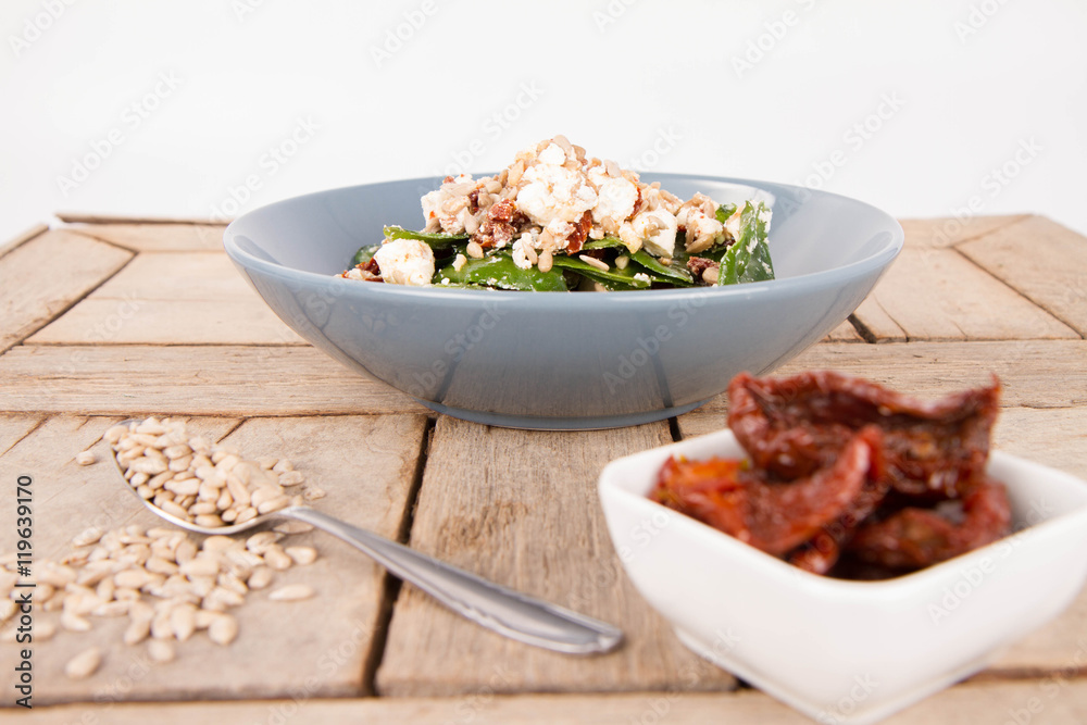 Spinach, dried tomatoes, feta cheese and sunflower seeds salad Spinach, dried tomatoes, feta cheese and sunflower seeds salad