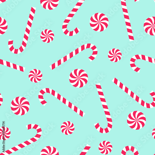 Candy cane and lollipop seamless christmas pattern on mint green background. Happy New Year and Merry Xmas background. Vector winter holidays print for textile, wallpaper, fabric, wallpaper.