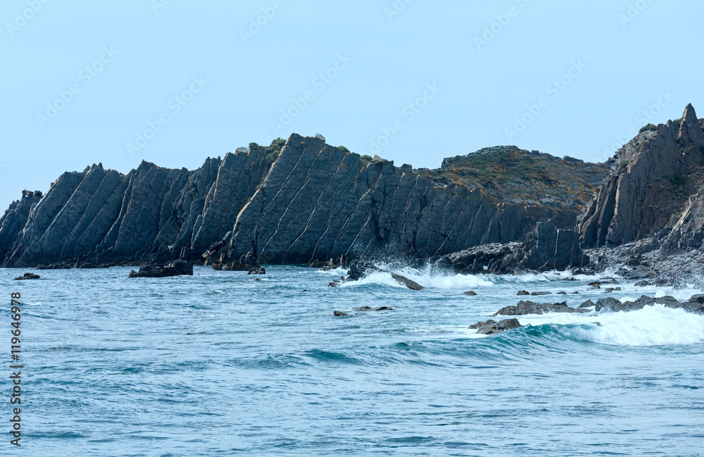 Summer Atlantic ocean rocky coastline (Algarve, Portugal).