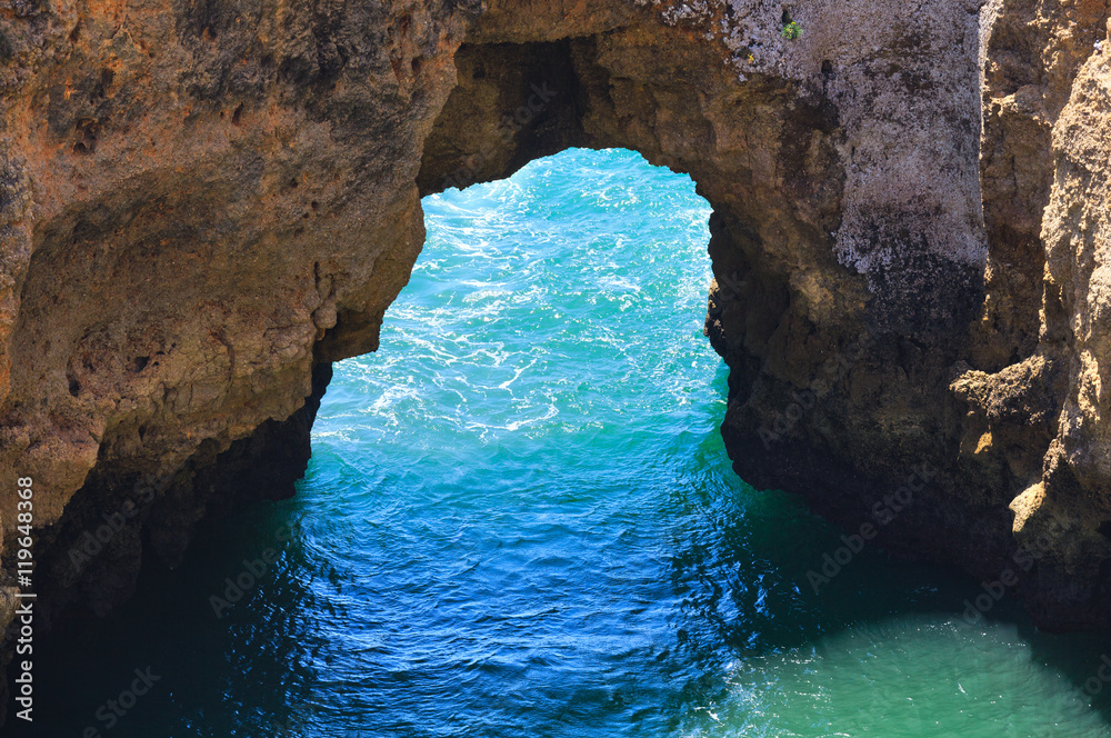 Sea view through rocky arch (Portugal).