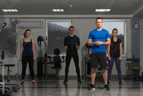 Group Of Sportive People In A Gym Training
