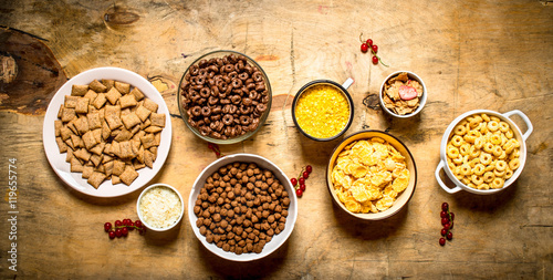 Fototapeta Naklejka Na Ścianę i Meble -  Cereal in cups. On wooden background.
