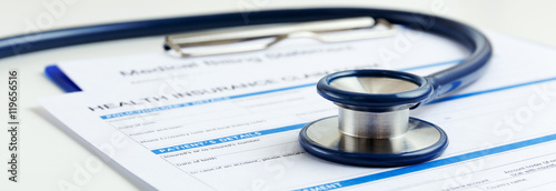 Stethoscope on health insurance form