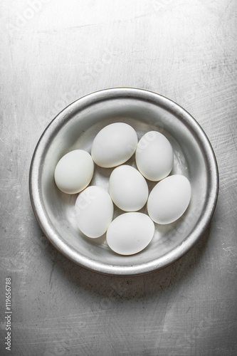 White eggs in a bowl .