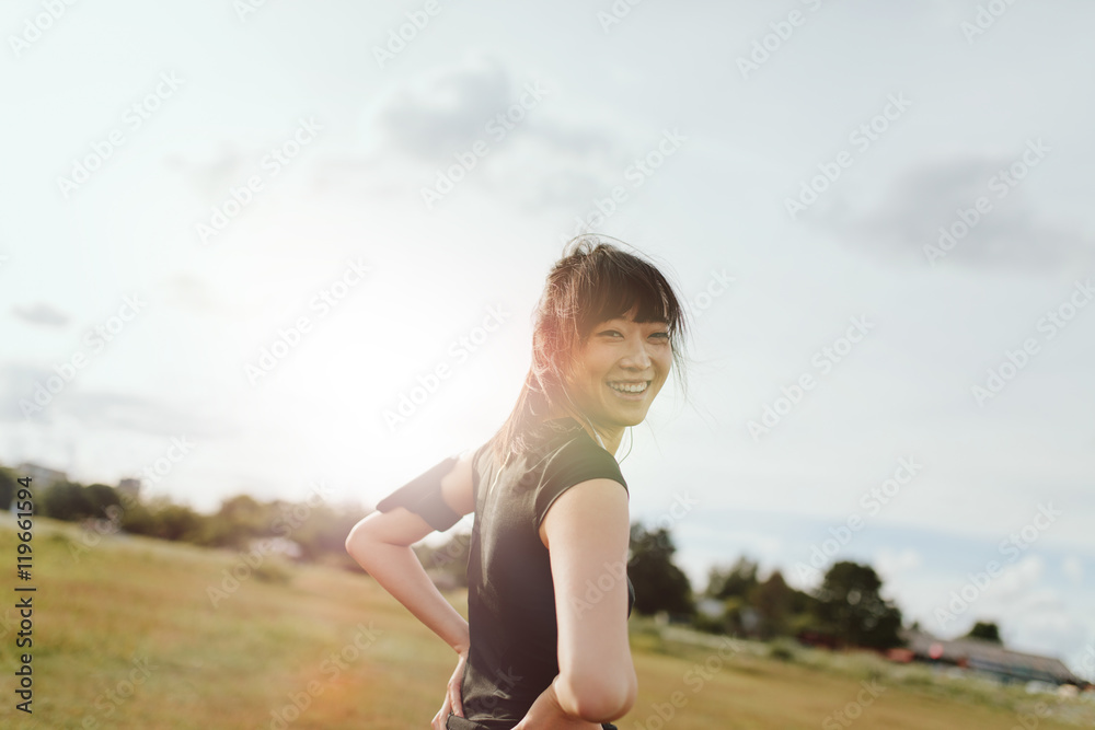 Fitness female on field in morning Fitness female on field in morning