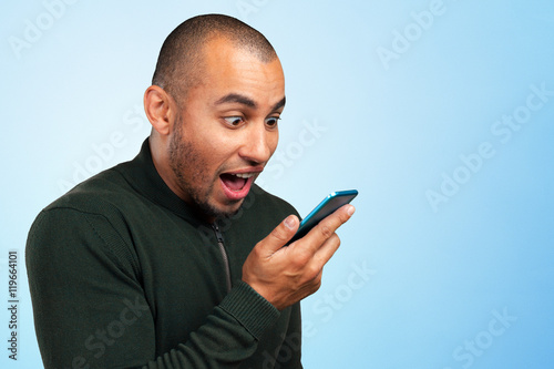 young and black man yelling at the cellphone