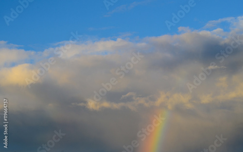 Nature cloudscape with blue sky and white cloud with and rainbow © thongsan