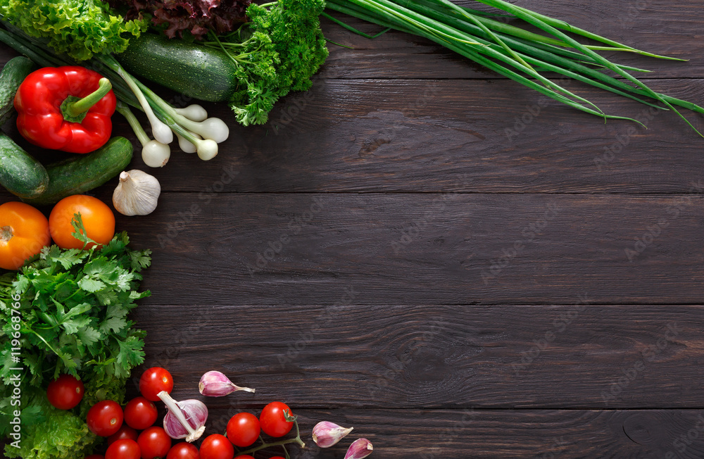 Border of fresh vegetables on wooden background with copy space - obrazy, fototapety, plakaty 