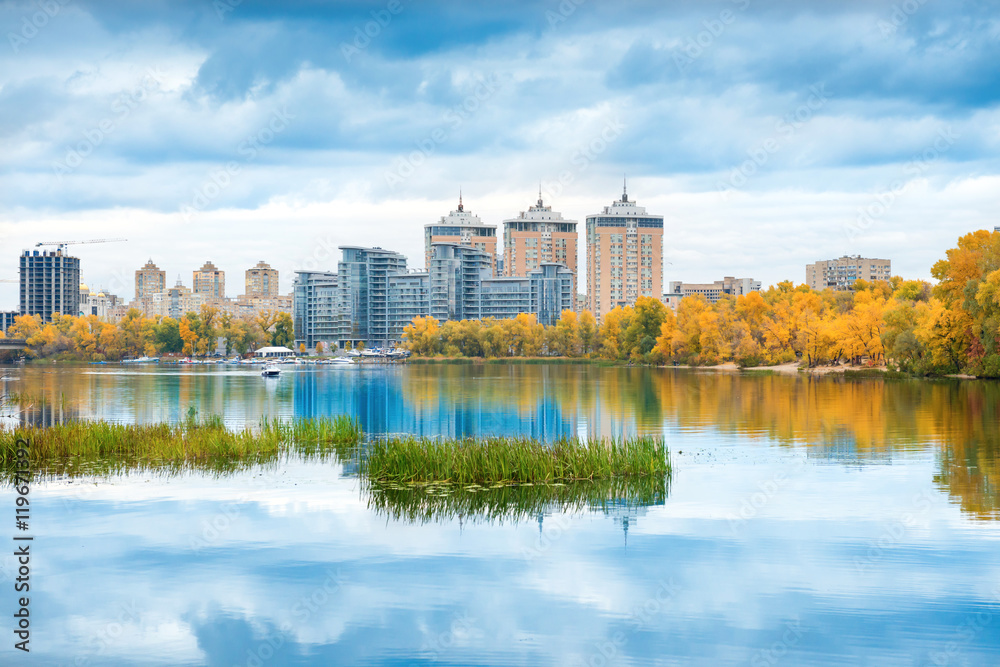 Lake with blue water and high buildings