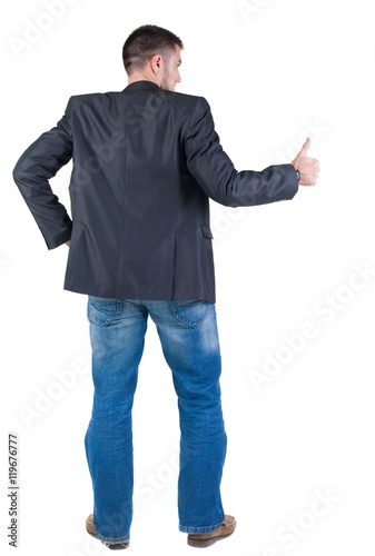 Businessman thumbs up. rear view. Isolated over white 