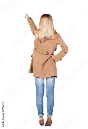 Back view of  pointing womanin brown cloak. beautiful brunette  girl. Rear view people collection.  backside view of person.  Isolated over white background. photo