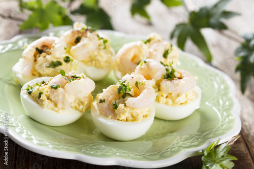 Stuffed eggs with shrimps and curry