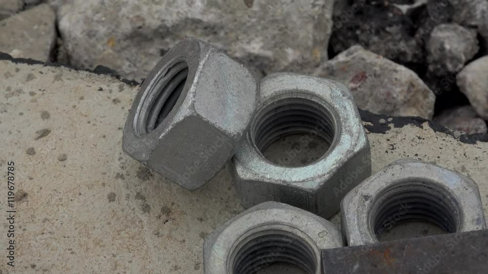 Base pedestal of support columns with big nuts & huge screw rods (Directly embedded in concrete ) on a building site. Base pedestal of support columns with big nuts & huge screw rods (Directly embedded in concrete ) on a building site.