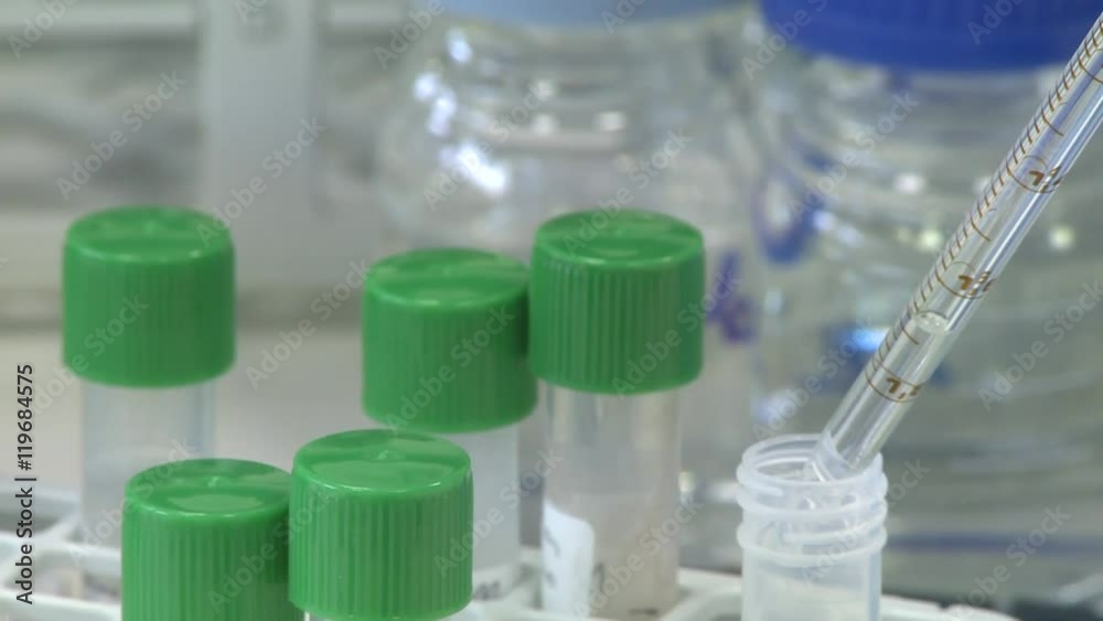 Pippette filling test tube, close up, RL PAN