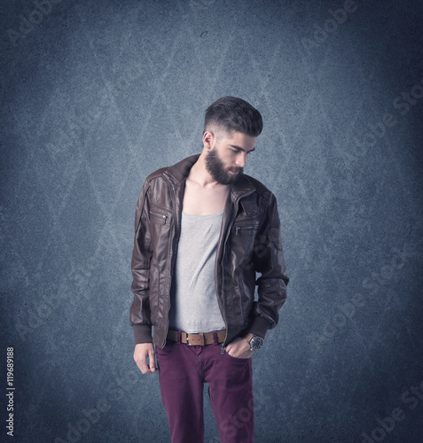 Bearded hipster standing in elegant clothes