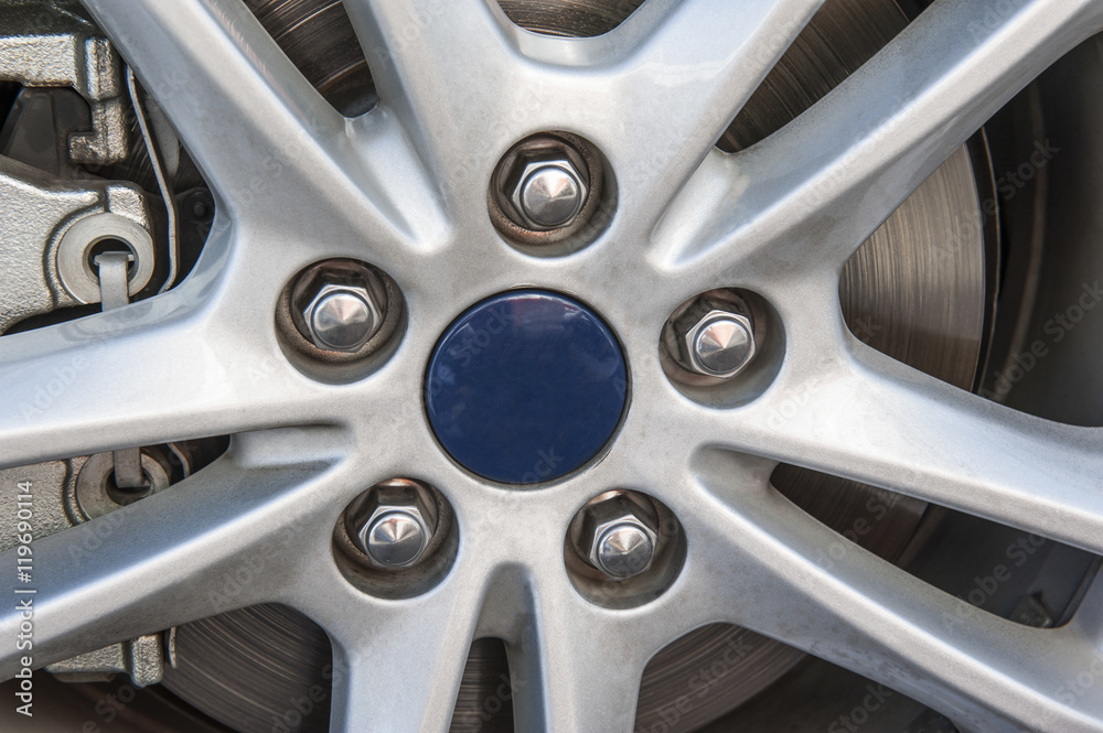 Closeup of wheel hub on car tyre Closeup of wheel hub on car tyre