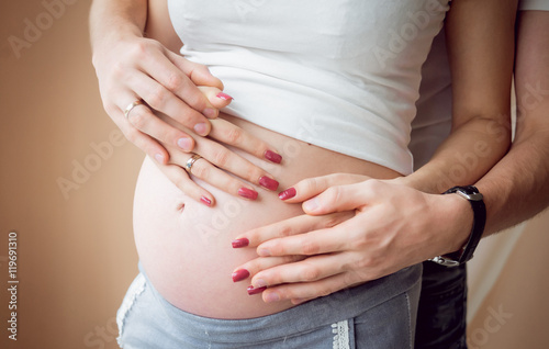 Young pregnant woman and her husband