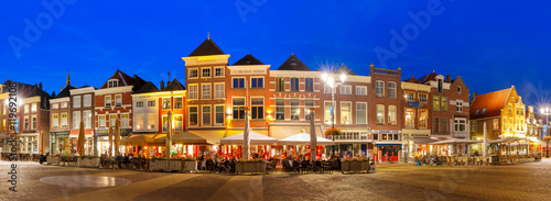 Panorama Markt square with typical Dutch houses in the center of the old city at night, Delft, Holland, Netherlands © Kavalenkava