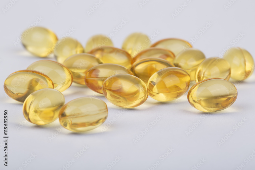 Fish oil capsules on the white Fish oil capsules on the white