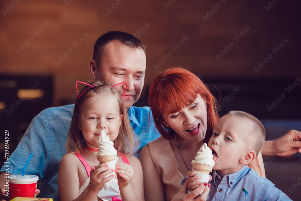 Happy family eating ice cream in restaurant Stock Photo | Adobe Stock