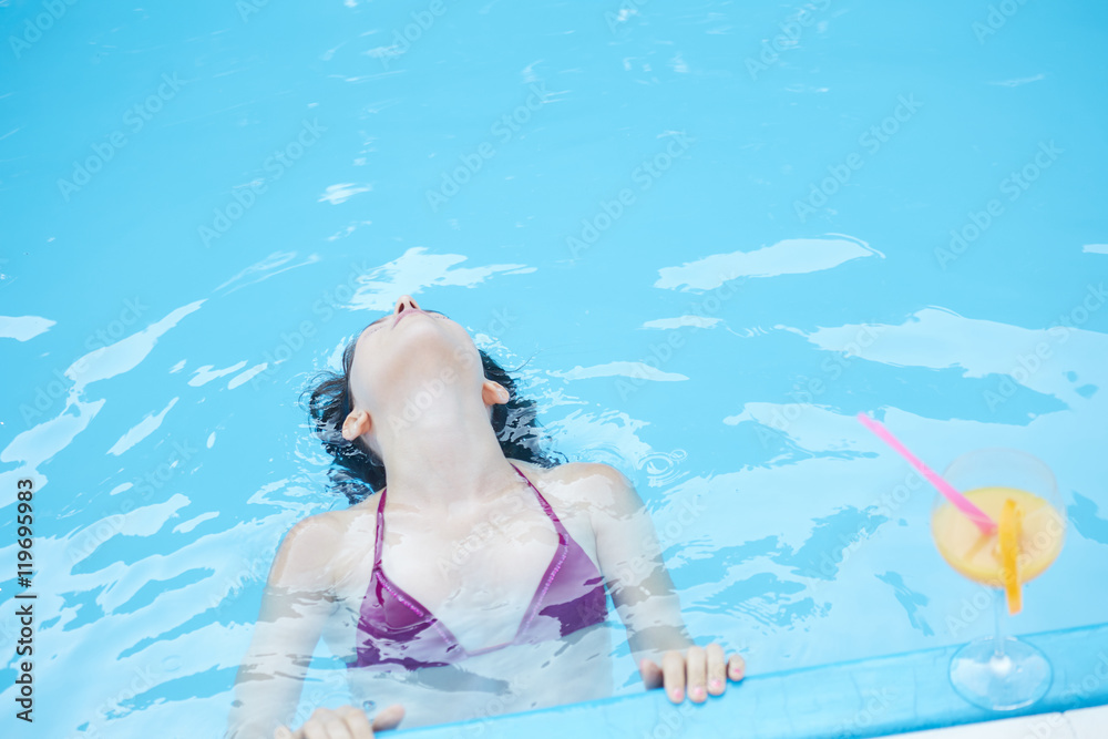 young woman relaxing at pool