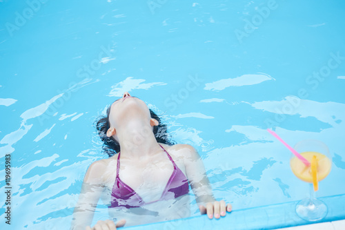 young woman relaxing at pool