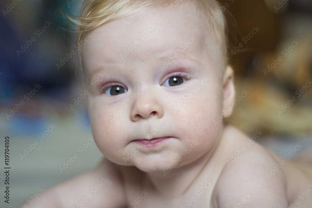 Cute baby lying on the bed, portrait, soft focus Cute baby lying on the bed, portrait, soft focus